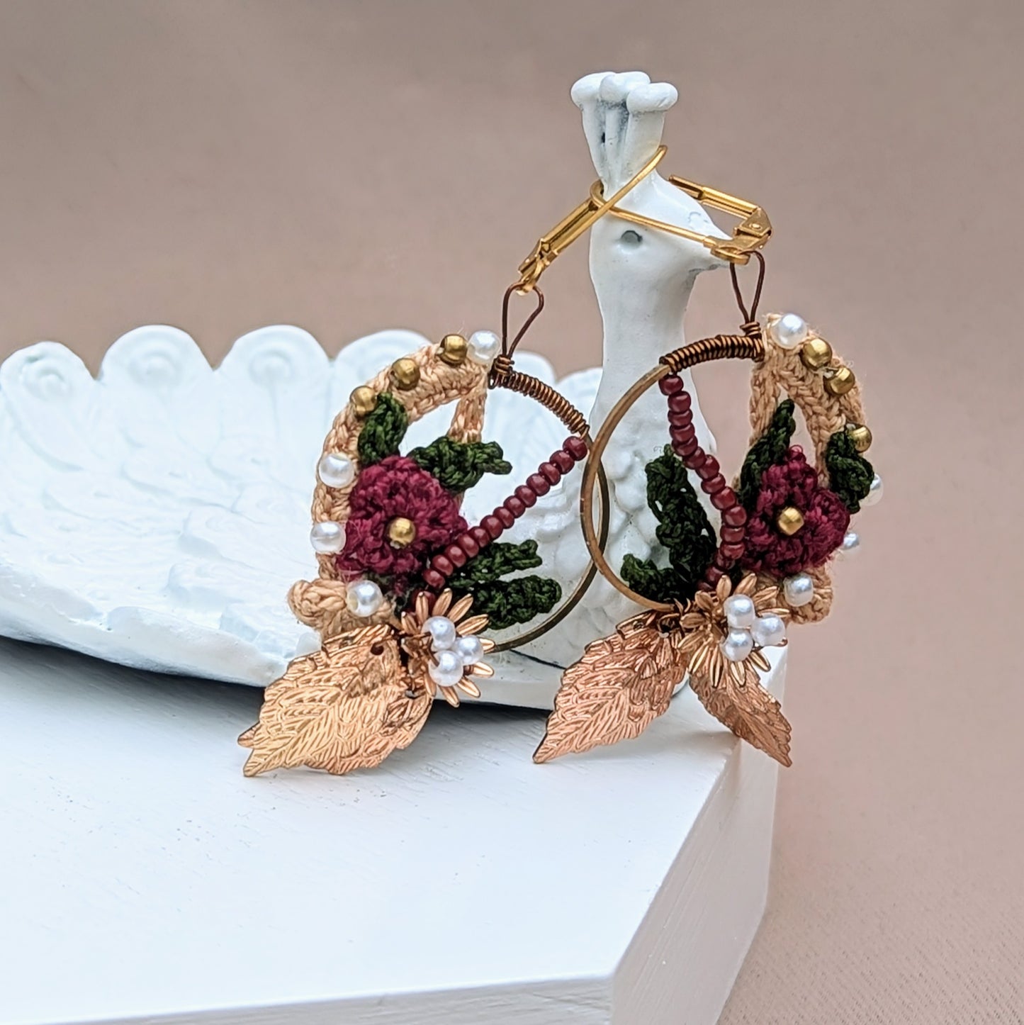 Celebrate Indian heritage with these handcrafted earrings exclusive to sustainable brand Mayaani Jewellery UK. Featuring red, green and gold hues, 14K gold-plated hoops and with delicate floral detailing they're perfect for any occasion.