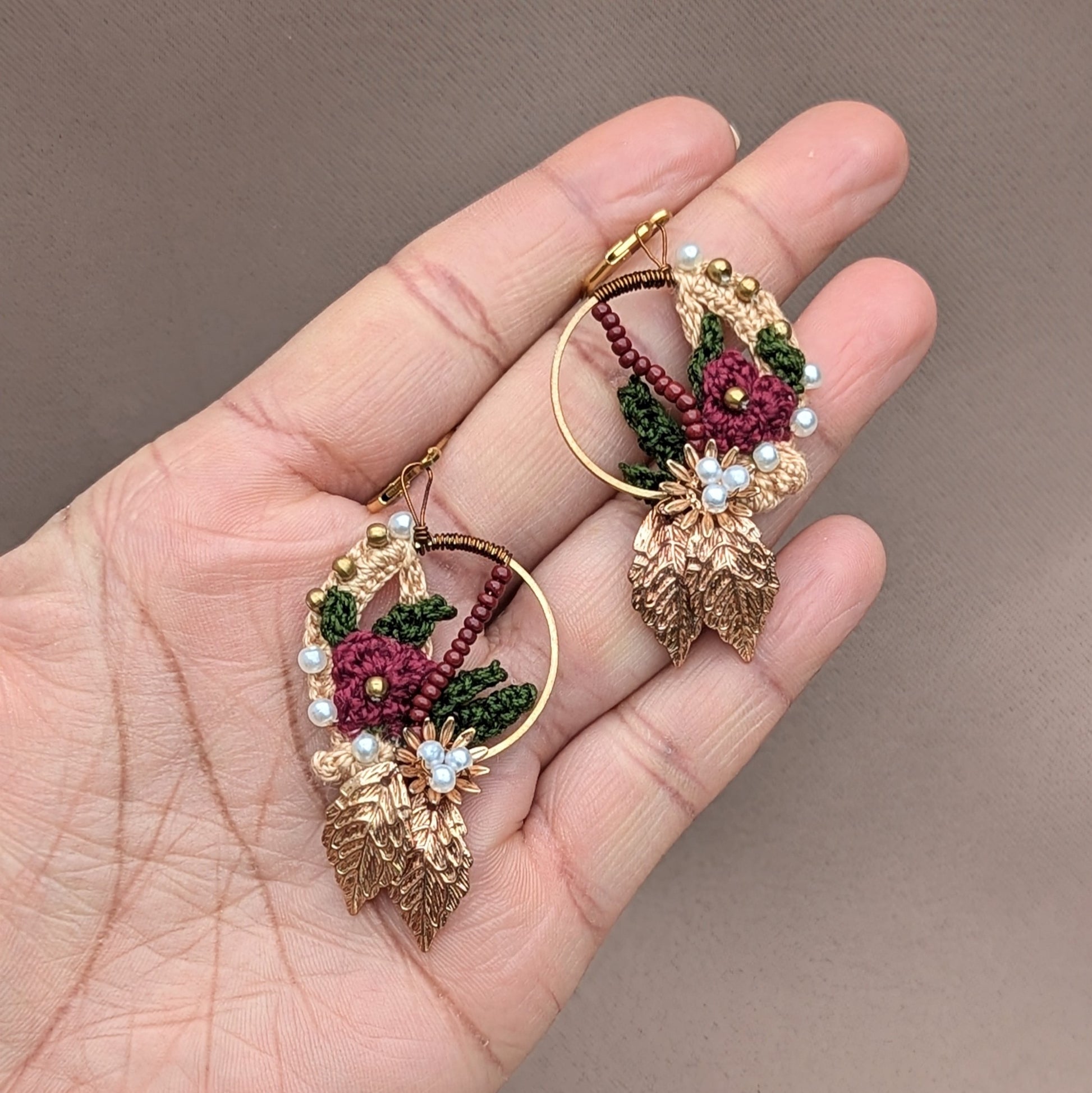 Sustainable Indian earrings by UK brand Mayaani Jewellery and UK Indian jewellery designer maker Megha featuring red, gold and green tones. Crafted with 14K gold-plated hoops, these lightweight, artisanal pieces reflect timeless tradition and modern quality.