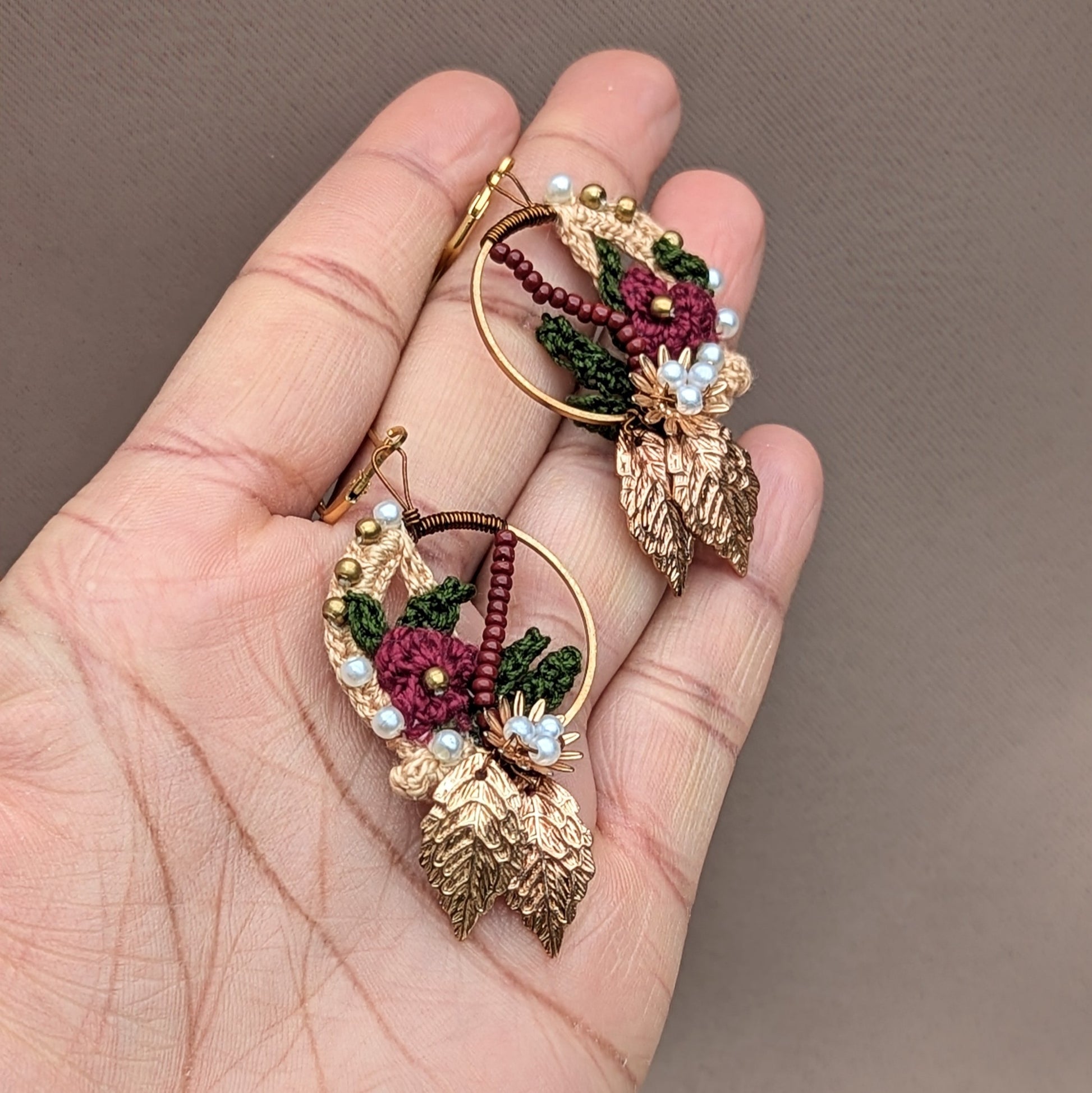 Traditional Indian earrings in timeless red, gold and green, designed and handcrafted by UK Indian artisan Megha of sustainable brand Mayaani Jewellery. These lightweight, sustainably handmade earrings feature 14K gold plated hoops and stainless steel clasps.