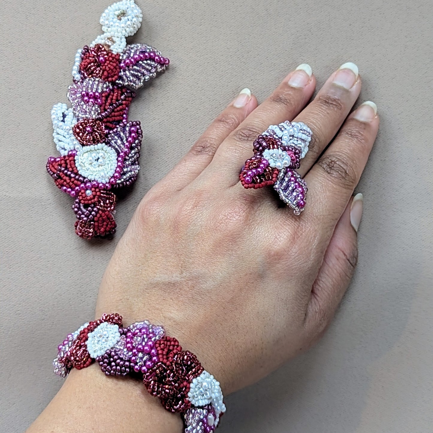 Gulab Rani, a signature Mayaani Jewellery Concept 4-in-1 Indian hand bracelet, is a handcrafted bridal piece with intricate bead embroidery and crochet. Designed for versatility, it transforms into four wearable styles—full hand bracelet, wrist bracelet, ring, and ring-wrist bracelet—merging tradition with modern luxury.