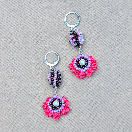 A bold colourful playful pair of handcrafted earrings exclusive to sustainable UK brand Mayaani Jewellery featuring in-house Indian designer maker Megha's signature concept scrap beads. Hand crochet, hand bead work and hand wire wrapping blend together in brilliant pinks, purples and lilac finished off with silver stainless steel clasp hooks. The perfect pop of colour for your occasion and everyday looks!