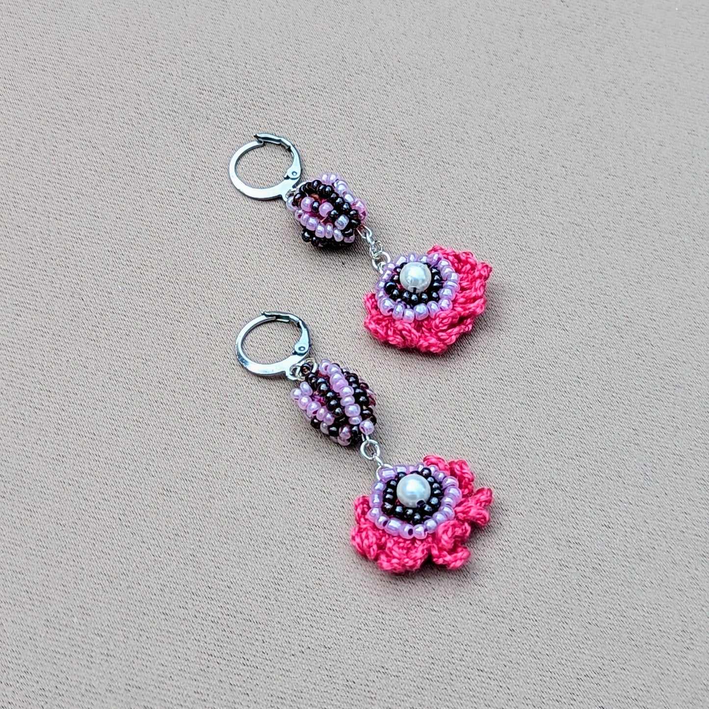 Discover these striking, colourful handcrafted earrings, an exclusive design from sustainable UK brand Mayaani Jewellery by in-house designer Megha. Showcasing her unique concept of scrap beads, these earrings feature hand crochet, detailed beadwork, and wire wrapping in vibrant pinks, purples, and lilac, all complemented by silver stainless steel clasp hooks. They’re the perfect accessory to brighten up any outfit, whether for special occasions or everyday wear!